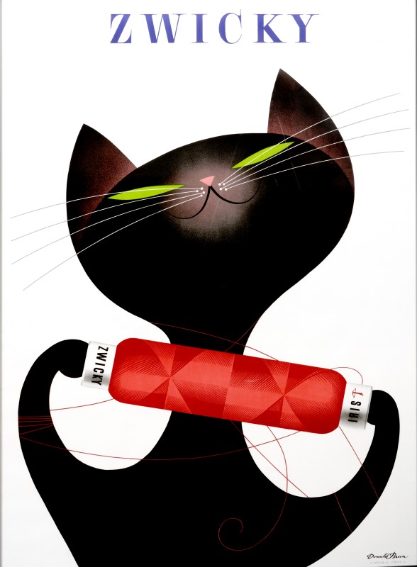 Cat plays with spool of yarn; black, red, green