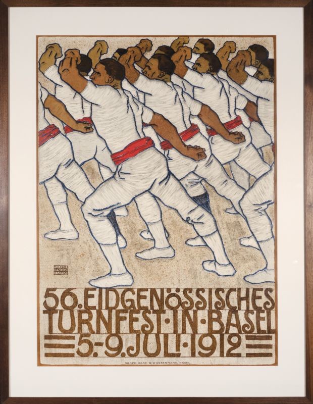 Crowd of gymnastics athletes in position; brown, red, blue